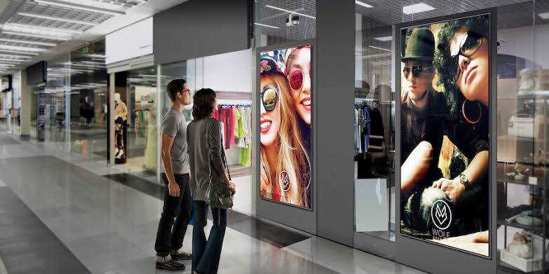 Digital advertising screens inside a retail environment